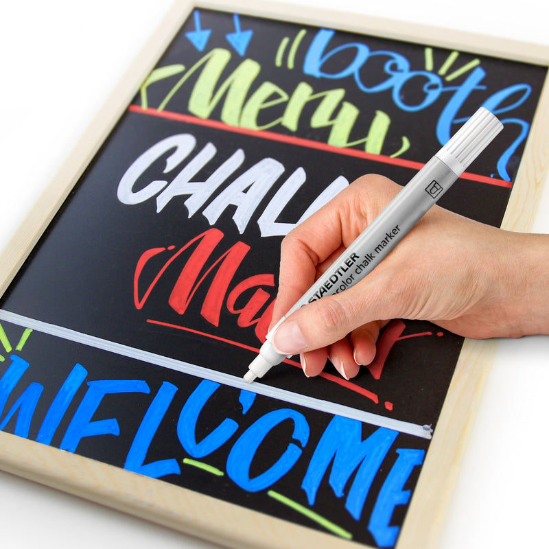 Hand lettering a blackboard with white chalk marker words Menu, CHALK Marker and WELCOME, with other colours from the Staedtler range