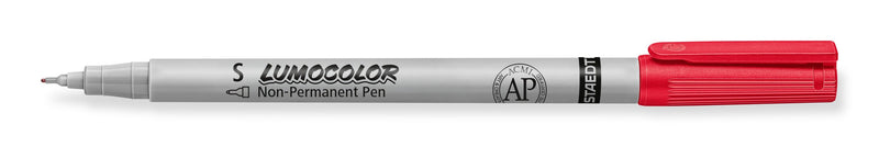 Uncapped red Staedtler Lumocolor 311 non-permanent pen lying flat, superfine tip on the left and red cap end on the right