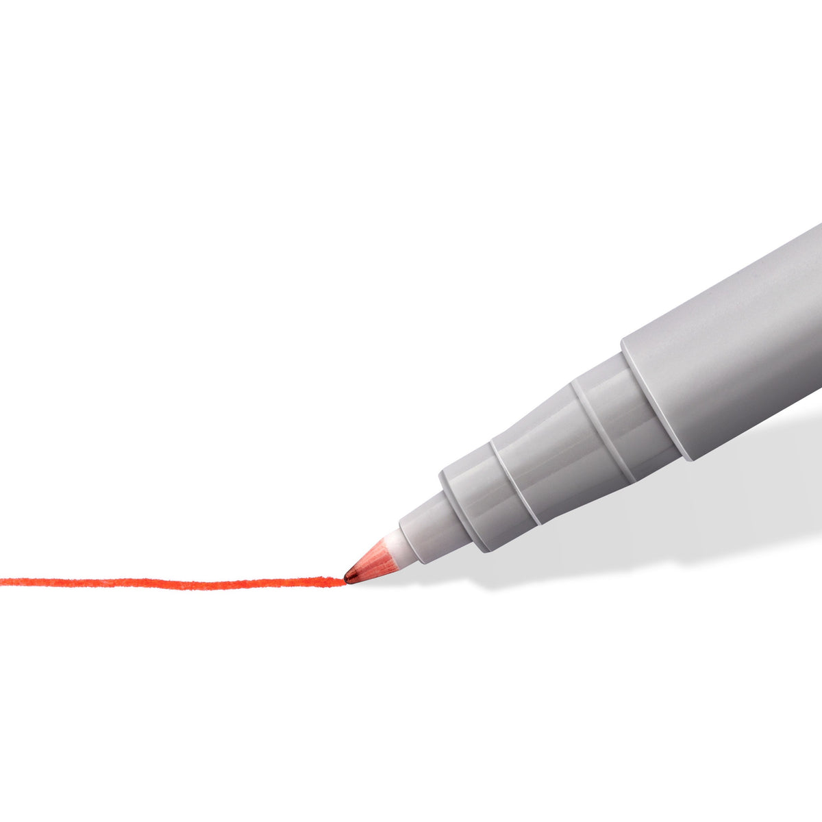 Close-up of a Lumocolor non-permanent fine tip drawing a thin red line