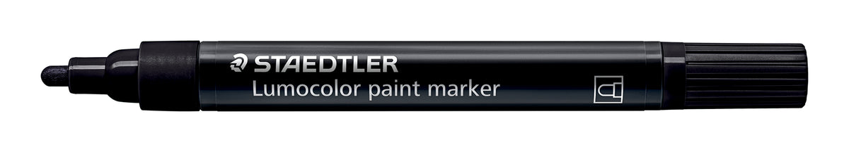 Uncapped black Staedtler Lumocolor paint marker lying flat, showing the bullet tip, black barrel and Staedtler lettering