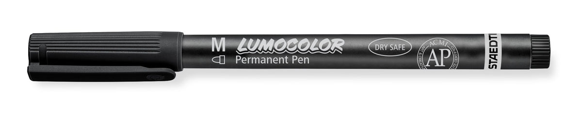 Black Staedtler Lumocolor permanent 317-9 pen with cap on, current barrel print with M, LUMOCOLOR Permanent Pen and a small AP mark
