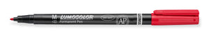 Red Staedtler Lumocolor permanent 317-2 medium pen lying flat, uncapped, with M on the black barrel