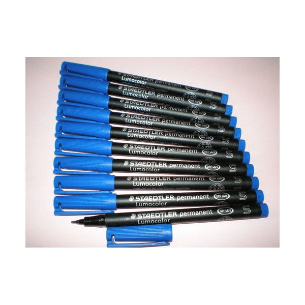 Ten blue Staedtler Lumocolor permanent superfine pens fanned on a pale surface with one cap removed
