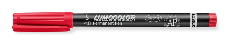 Red Staedtler Lumocolor permanent 313-2 superfine pen with cap on, barrel printed S, LUMOCOLOR Permanent Pen and a small AP mark