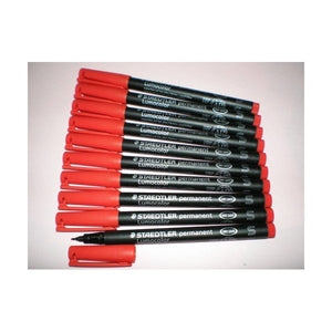 Photo of ten red Lumocolor permanent superfine pens fanned out on a pale background, one uncapped
