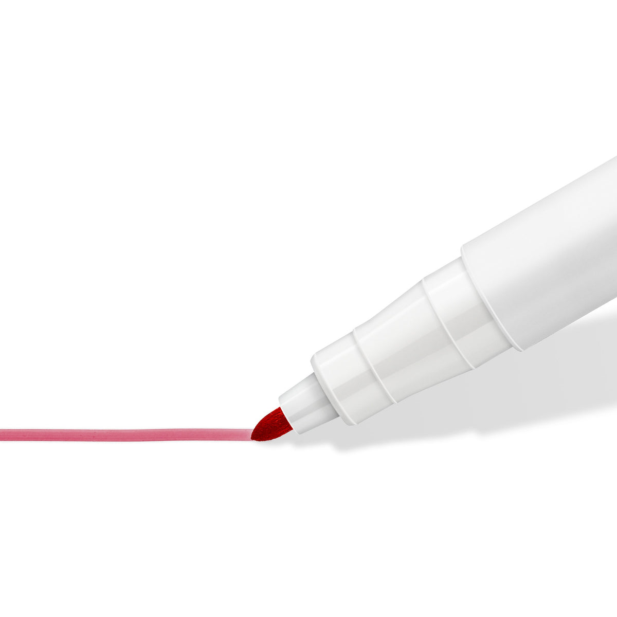 Close-up of the Lumocolor 301 pen tip writing a thin red line, shown in red