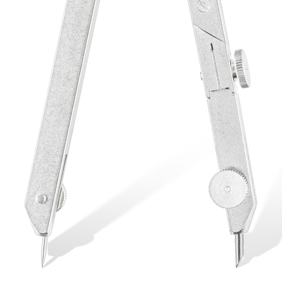 Close-up of the 551 compass tips, showing the shouldered needle in the hinged needle shoe and the lead leg