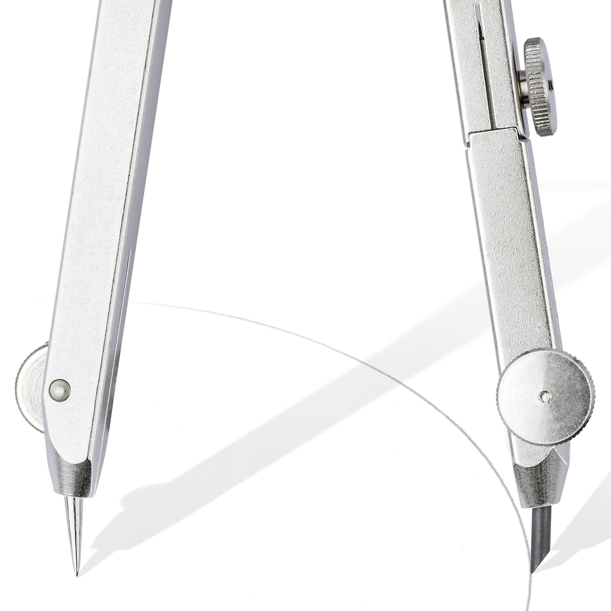 Close view of the hinged silver lead and needle legs of the Staedtler 552 compass angled inwards while drawing an arc