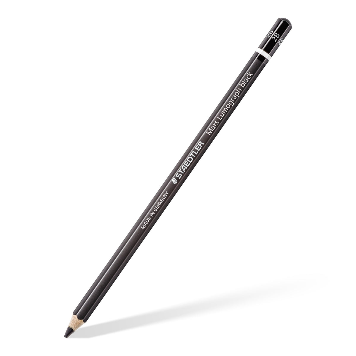 Single Mars Lumograph black pencil with a black barrel and white ring, sharpened and shown at an angle
