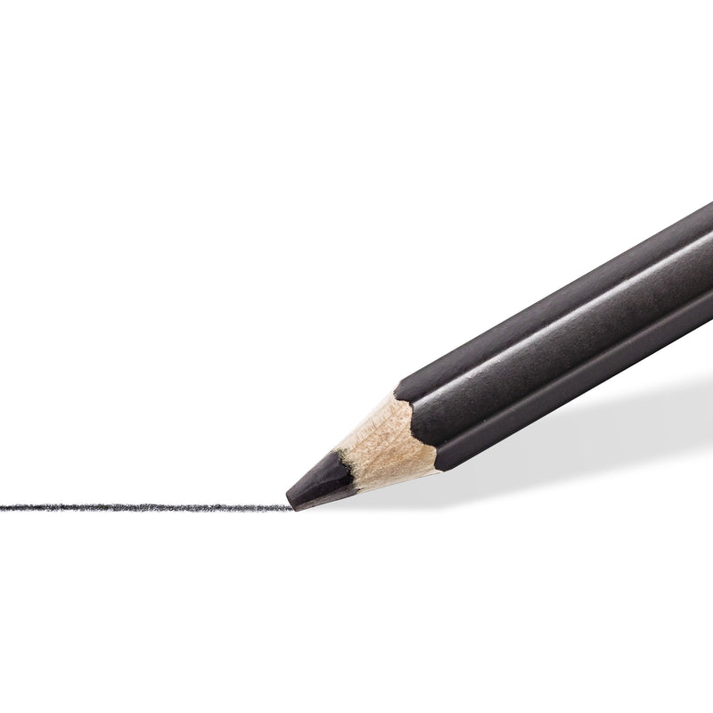 Close-up of a sharpened Lumograph black pencil drawing a dark line on white paper
