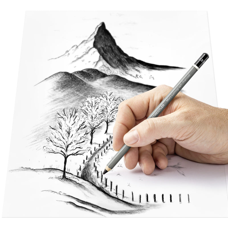 Hand drawing a mountain, bare trees and a fenced path in charcoal with a Staedtler Mars Lumograph charcoal pencil, Staedtler range photo