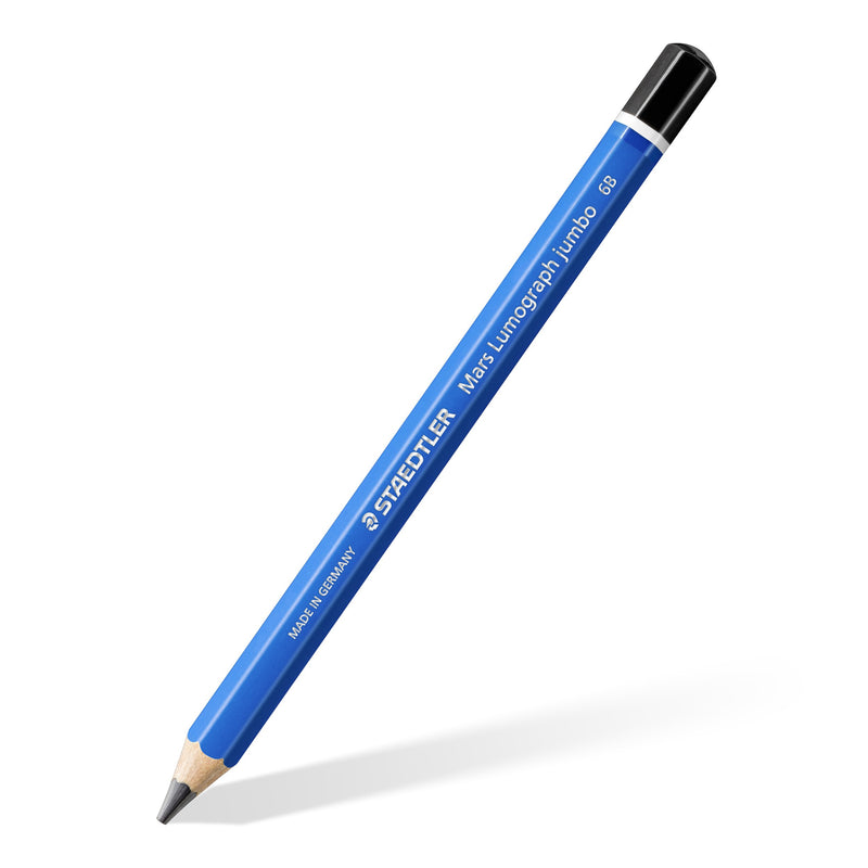 One Mars Lumograph jumbo 6B pencil on a diagonal, thick blue barrel with STAEDTLER lettering and a black end cap