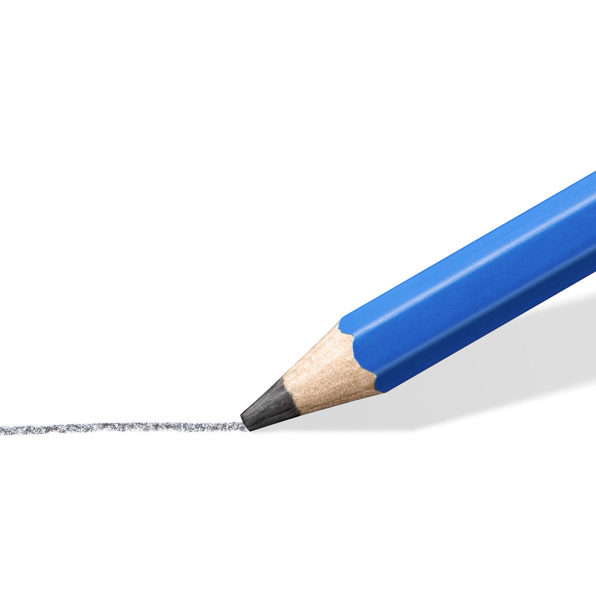 Close-up of a sharpened Mars Lumograph 6B tip drawing a soft dark graphite line on white paper