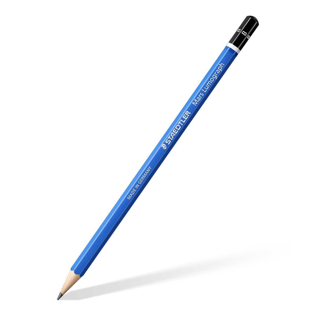 One blue Mars Lumograph B pencil lying diagonally with a sharpened point, black end cap printed B and silver STAEDTLER lettering on the barrel
