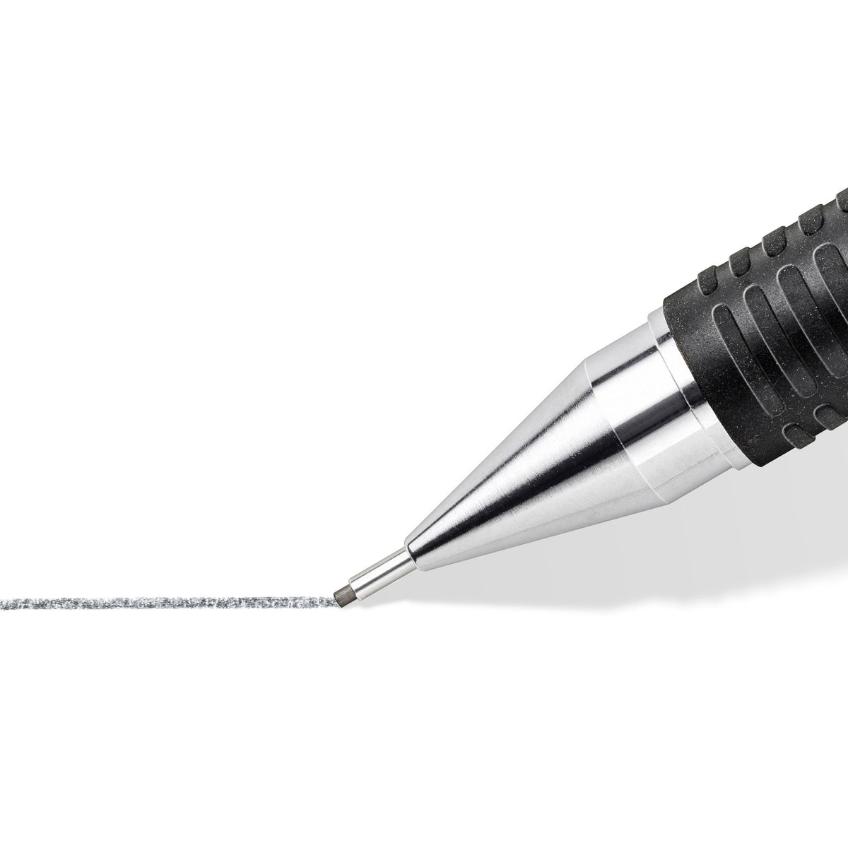 Close-up of a Mars micro metal sleeve drawing a broad grey pencil line