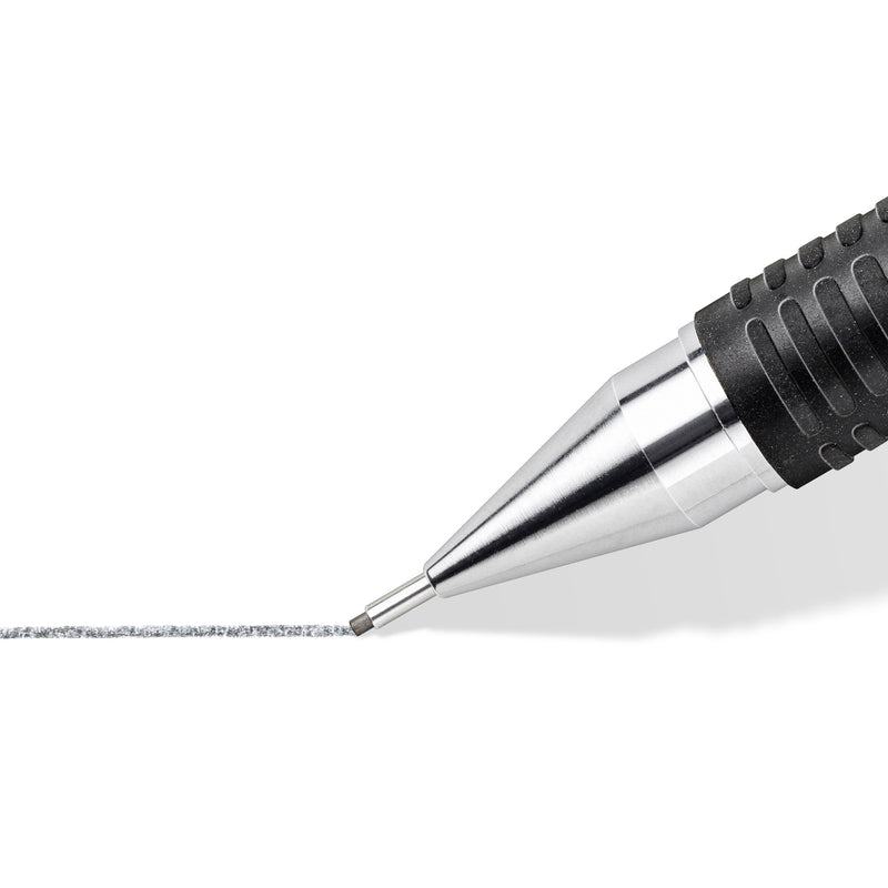 Close-up of a Mars micro metal sleeve drawing a broad grey pencil line
