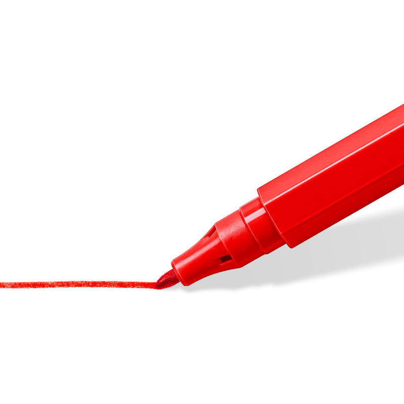 Close view of a red Noris 326 fibre tip drawing a thin red line on white paper