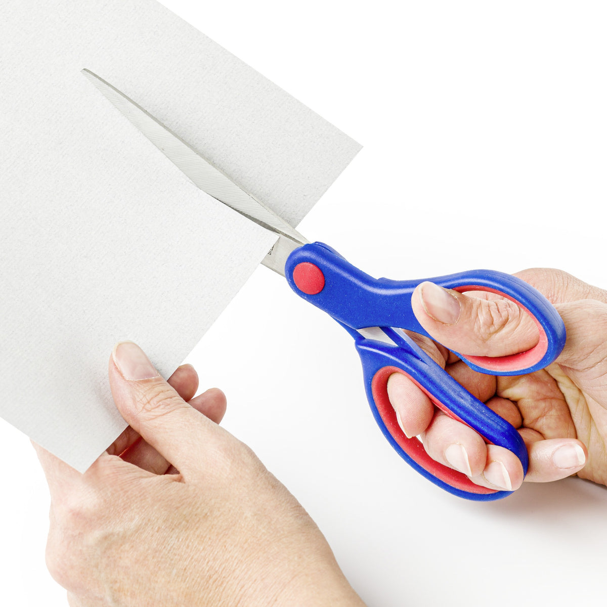 Hands cutting a sheet of grey card with the 21 cm Noris hobby scissors