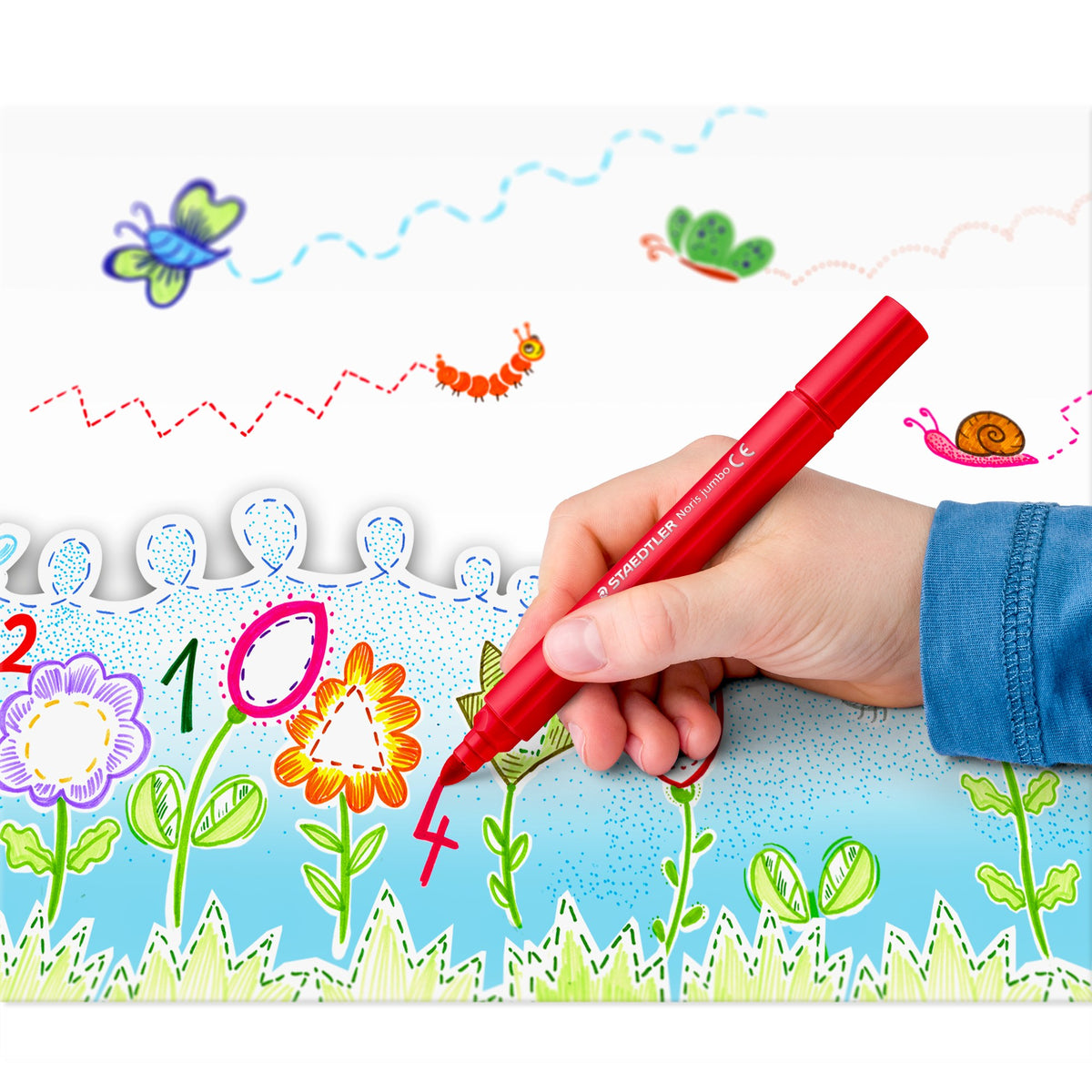 Child hand colouring flowers and numbers on a picture with a red Staedtler Noris jumbo triangular pen