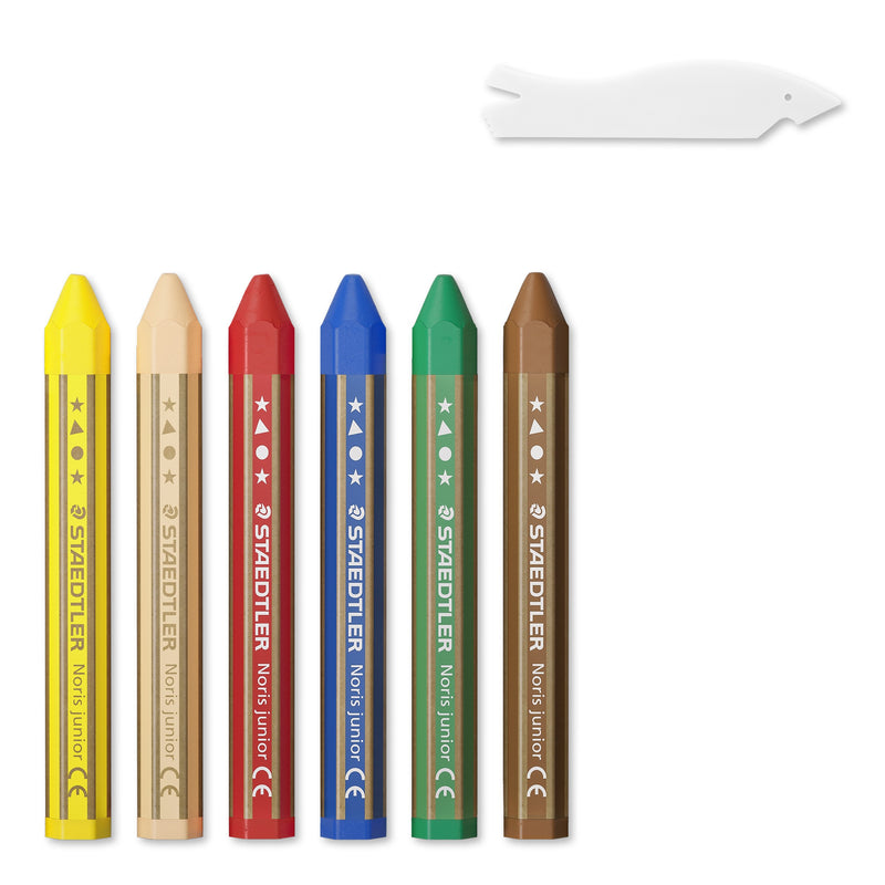 Contents of the Noris junior 224 C6: six hexagonal paper-wrapped wax crayons in yellow, peach, red, blue, green and brown, with a small white scraper