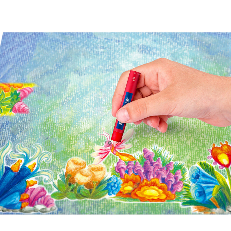 Hand colouring an underwater scene of fish and coral with a red Staedtler 241 oil pastel