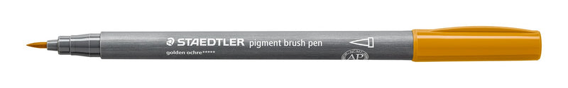 Staedtler 371-16 pigment brush pen in golden ochre shown open on white, grey barrel with a golden ochre end and the pointed brush nib exposed