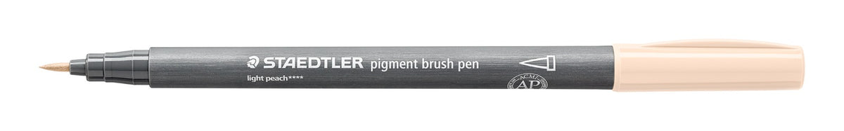 Staedtler 371-431 pigment brush pen in light peach lying open on white, grey barrel, light peach cap posted on the end and the pointed brush nib at left