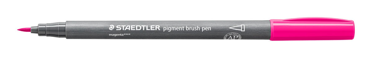 Staedtler 371-20 pigment brush pen in magenta lying open on white, grey barrel, magenta cap posted on the end and the pointed brush nib at left