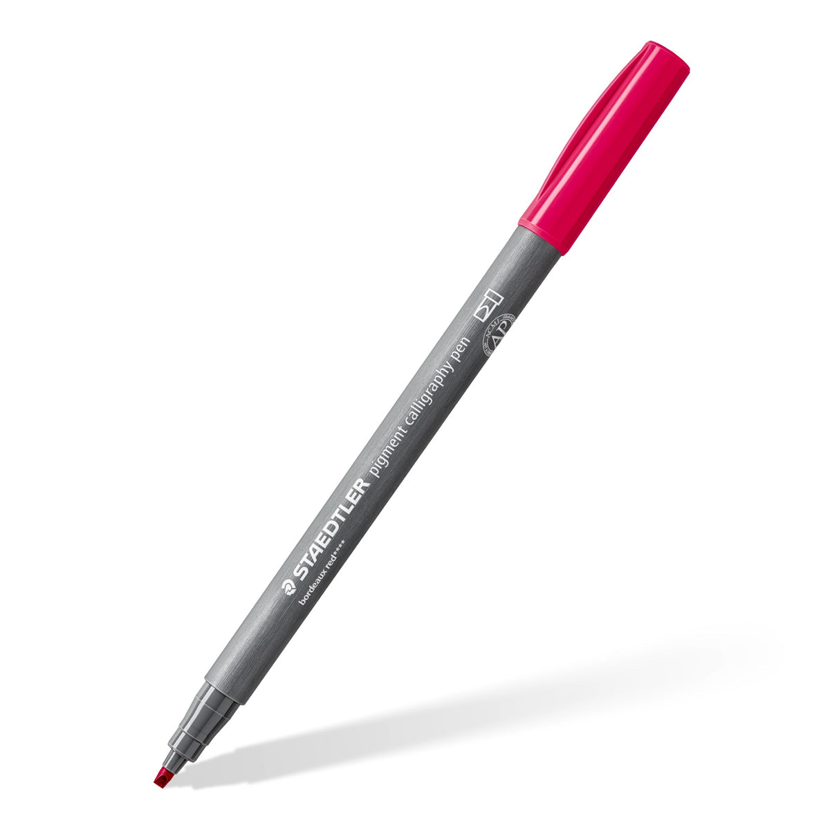 Staedtler 375 pigment calligraphy pen lying at an angle with its chisel tip showing; Staedtler range photo of the bordeaux red pen