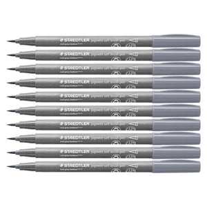 Ten Staedtler 372 pigment soft brush pens in cool grey medium lined up, grey barrels with mid grey caps and soft brush tips pointing left