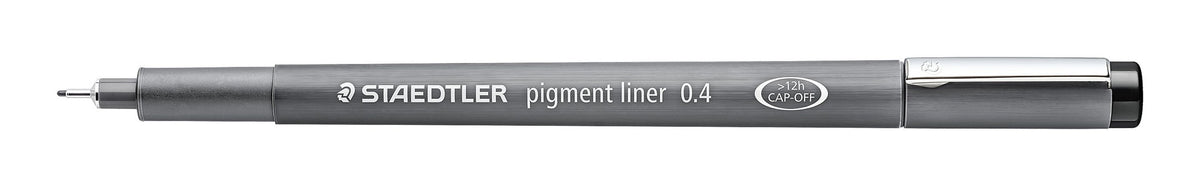 Staedtler pigment liner 0.4 lying flat with the cap off, showing the long metal tip and grey barrel