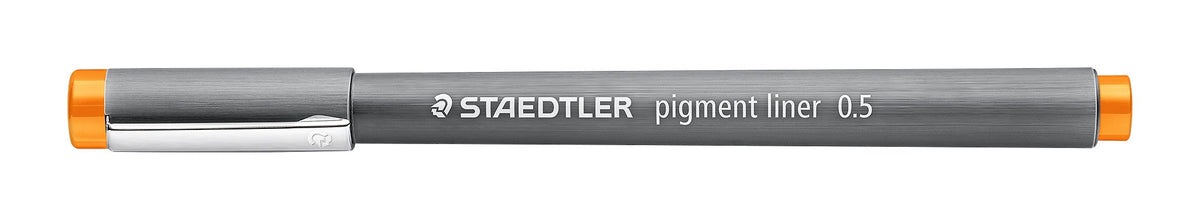 Staedtler pigment liner 0.5 in orange shown capped, grey barrel with a silver clip and an orange end band