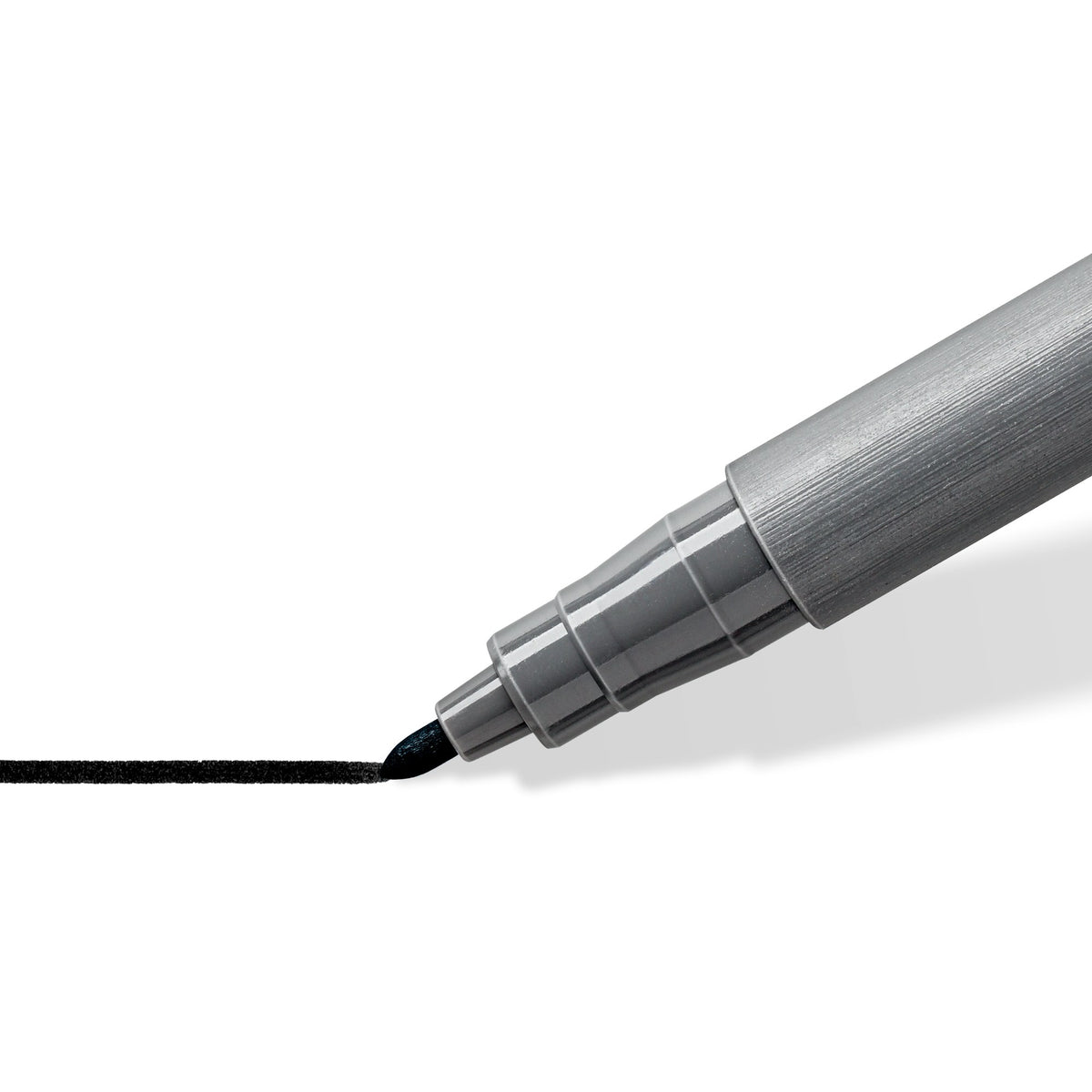 Close view of the 376 bullet tip drawing a straight black line, with the grey stepped grip section of the pen