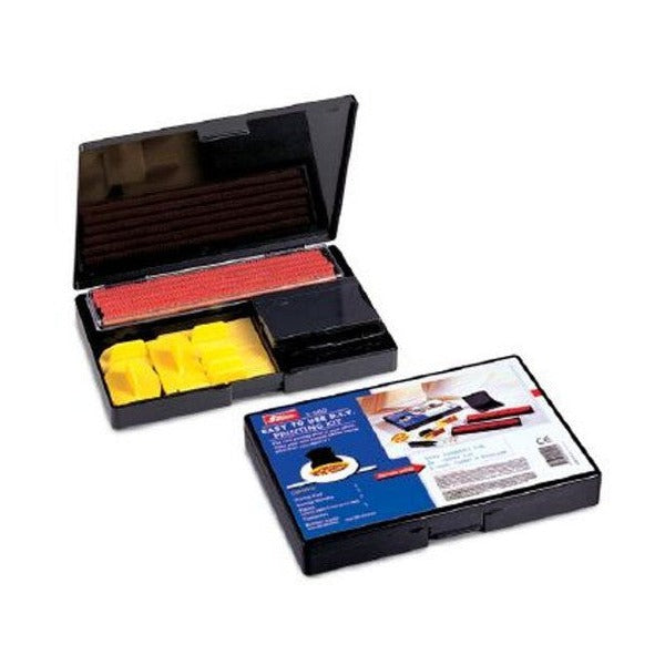 Shiny 9S100 kit shown open with yellow holders and red type strips, next to the closed black case wearing its navy and photo sleeve