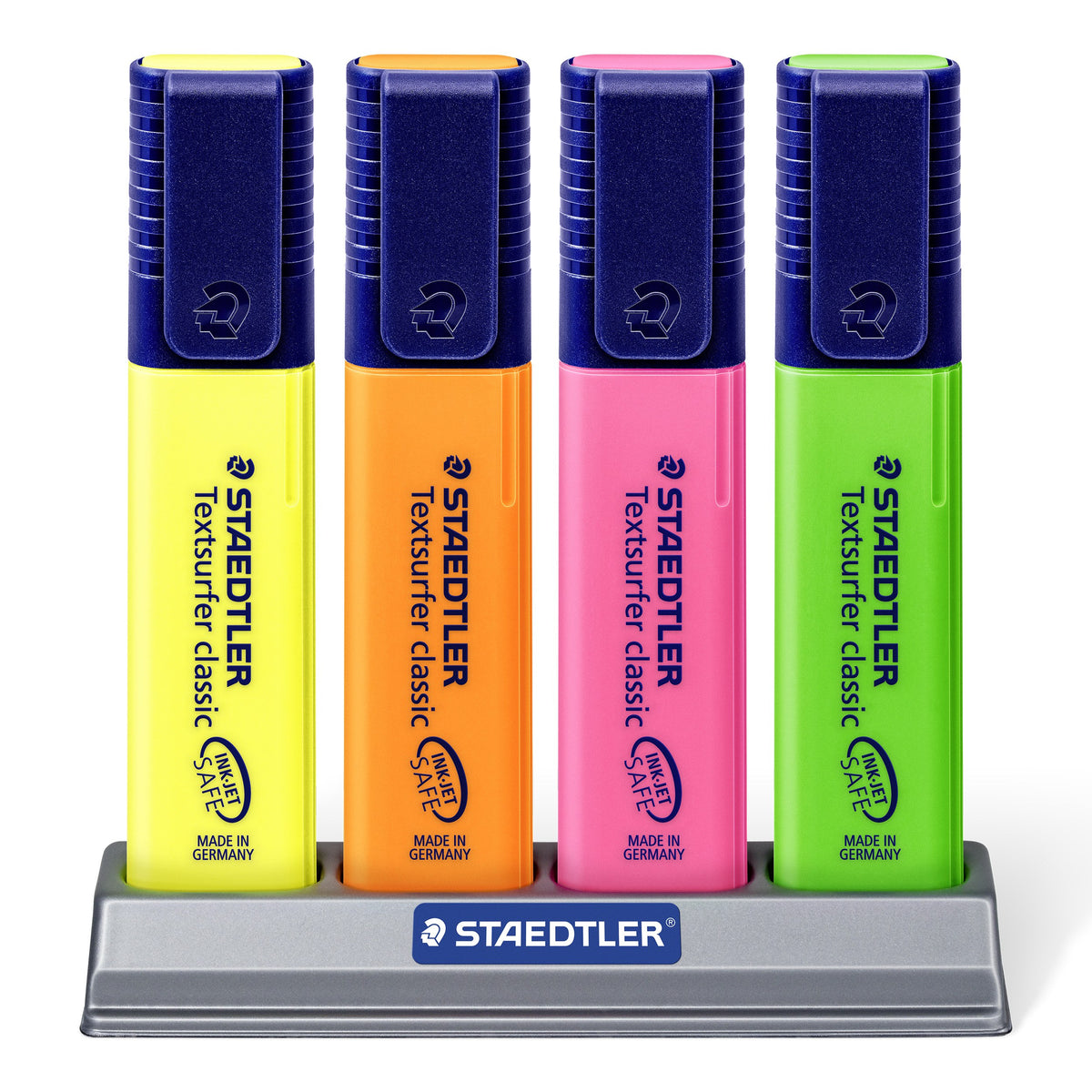 Four Textsurfer classic highlighters in yellow, orange, pink and green standing upright in the grey Staedtler desk stand