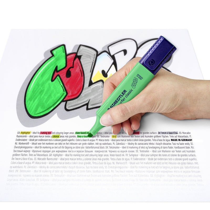 Hand colouring COLORS lettering in pale green with a Textsurfer classic over printed text