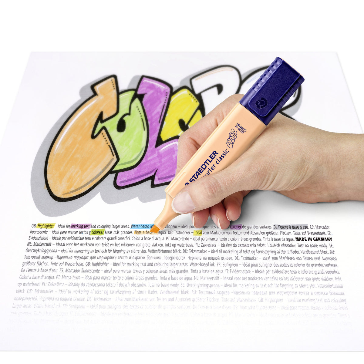 Hand shading COLORS lettering in peach with a Textsurfer classic on a printed sheet