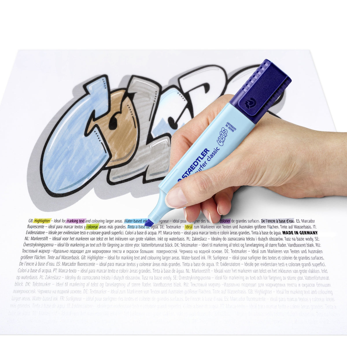 Hand colouring a large graffiti style letter with a sky blue Textsurfer classic over printed text