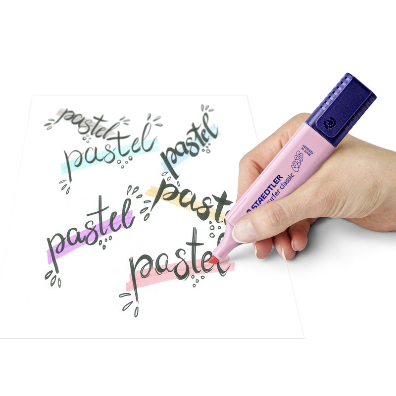 Hand writing pastel lettering with a pink Textsurfer classic, colourful pastel strokes behind the word