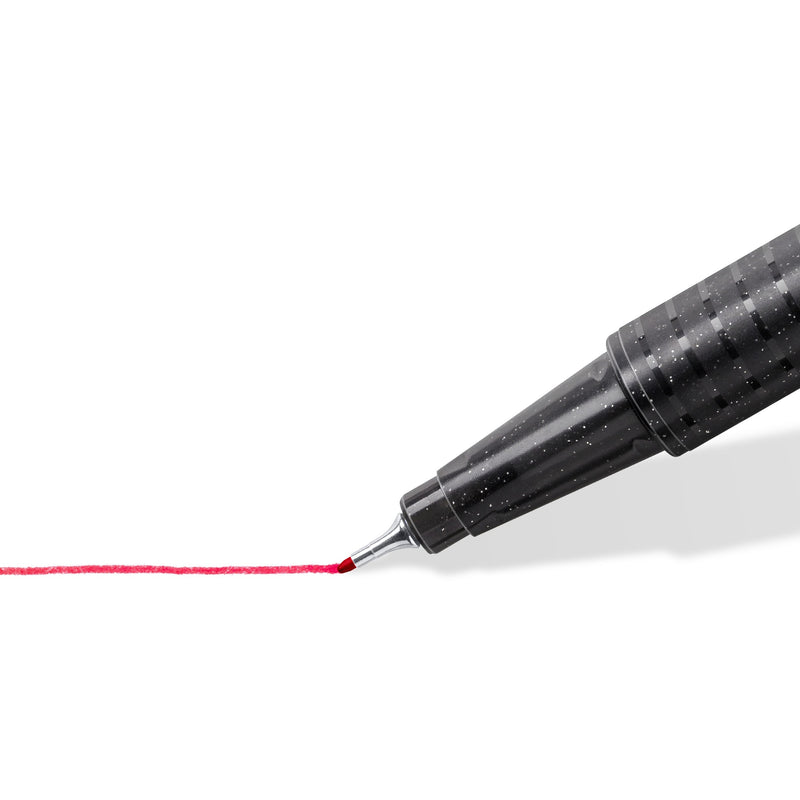 Staedtler close-up of the triplus fineliner metal-clad tip on a dark speckled barrel drawing a thin red line
