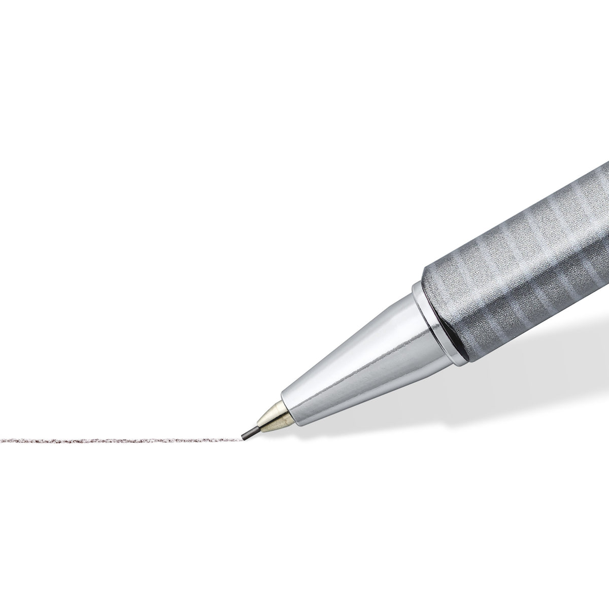 Close-up of the chrome-plated tip and slim lead sleeve of the triplus micro drawing a fine grey pencil line on white