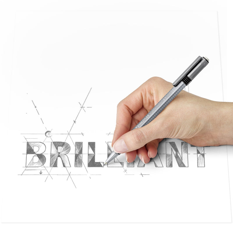 A hand sketching guide lines around the word BRILLIANT with a grey triangular triplus micro mechanical pencil