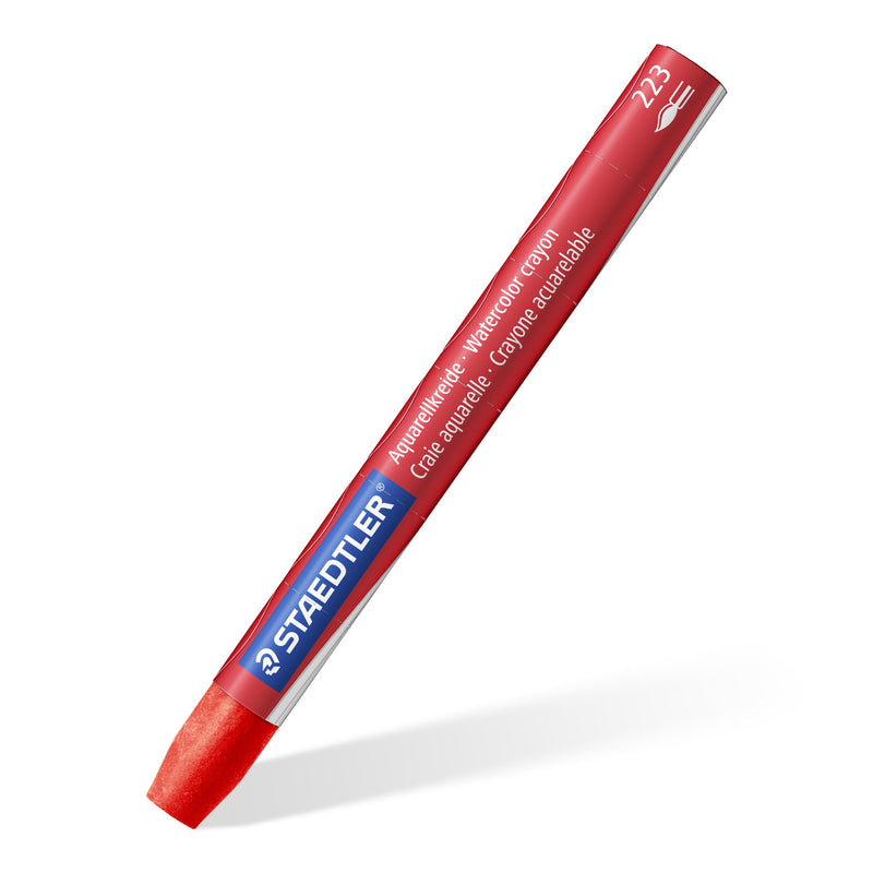 A single red Staedtler 223 watercolour crayon in its printed paper sleeve, shown on a diagonal against white