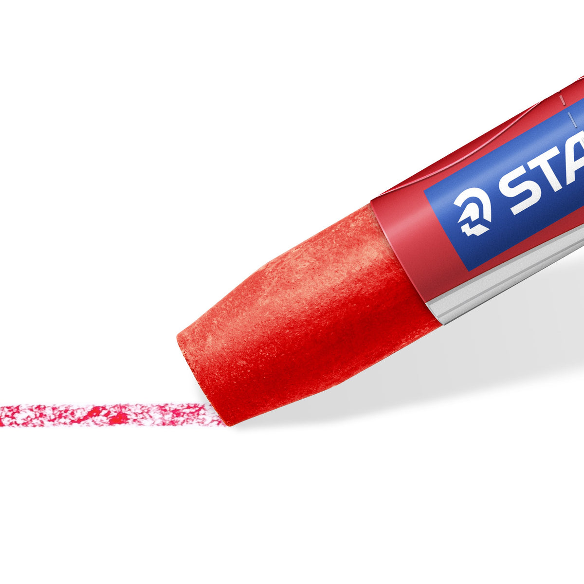 Close-up of the rounded red crayon tip leaving a textured red line on white paper