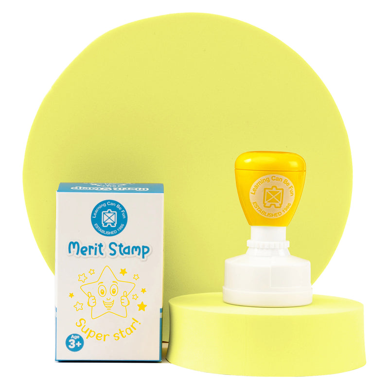 Super Star Merit Stamp displayed with retail packaging on a yellow presentation stand. The image shows the Learning Can Be Fun classroom reward stamp, packaging and cheerful star design for student encouragement.