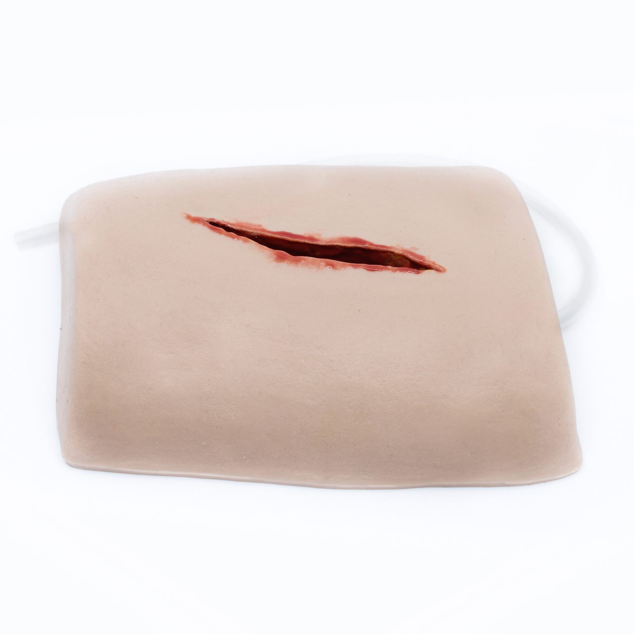 TRAUMASIM Laceration Haemostatic Clotting Trainer showing medical-grade silicone wound trainer for realistic haemostatic gauze packing and clotting agent skills practice