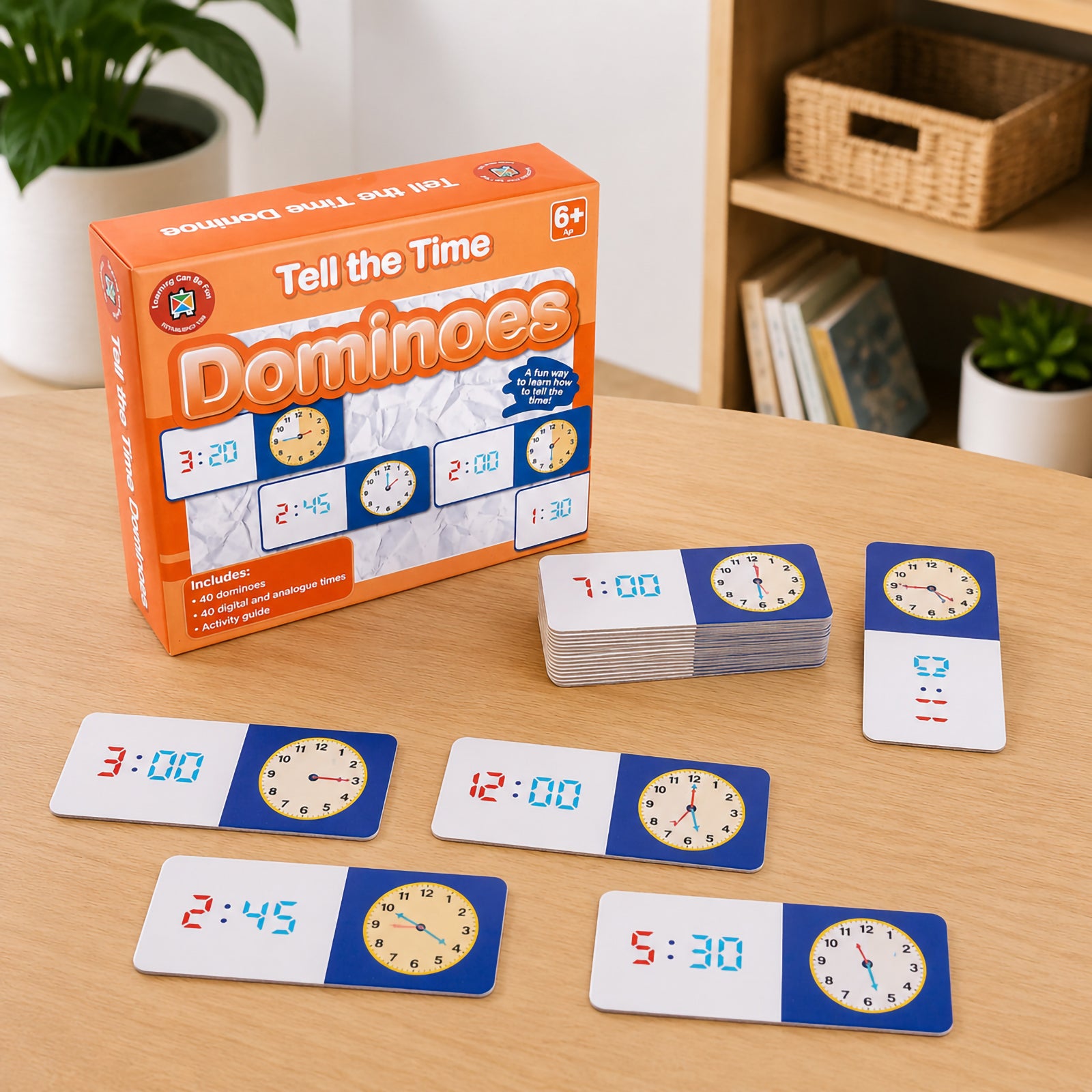 Tell the Time Dominoes educational set displayed with packaging, domino cards and sample time matching activities. The resource is designed to support analogue and digital time recognition in classroom and home learning environments.