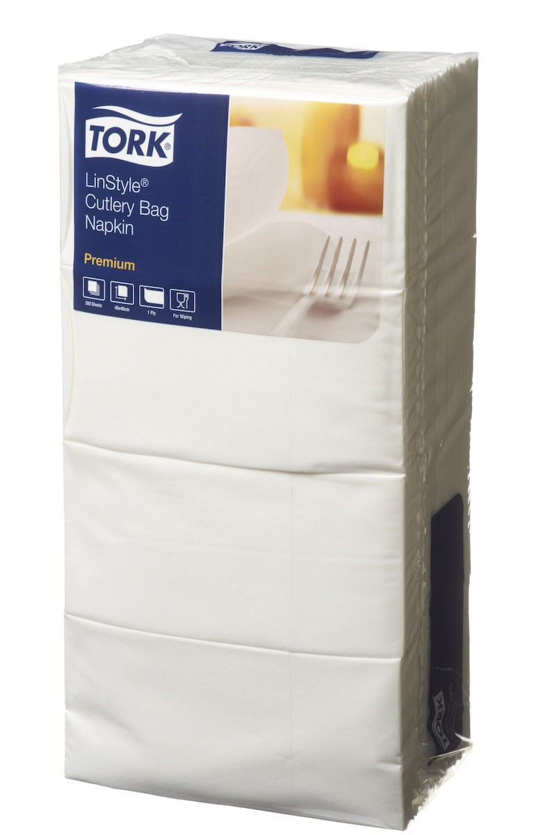 Stacked pack of white Tork LinStyle cutlery bag napkins with the blue Tork label across the top of the pack