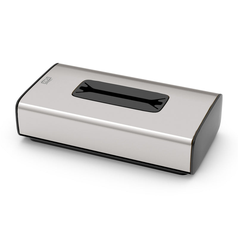 Brushed stainless steel Tork facial tissue dispenser with a slot opening on the top face, shown as the dispenser this tissue refill is made for
