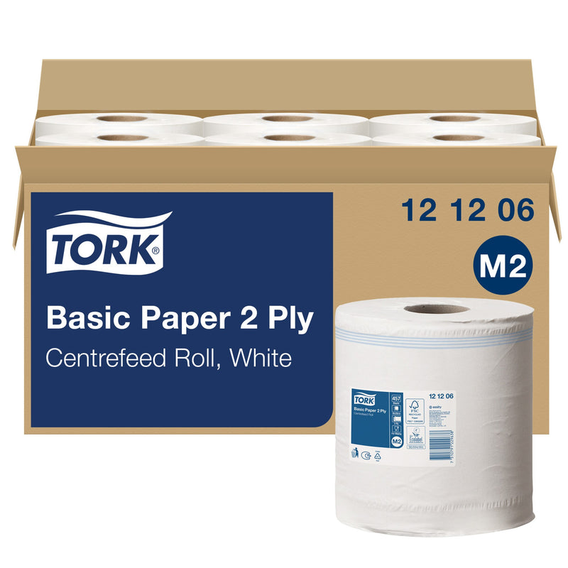 Open brown cardboard carton holding six white Tork centrefeed rolls, the front panel printed with a navy label reading Tork Basic Paper 2 Ply Centrefeed Roll White, code 12 12 06 and an M2 symbol, one loose roll standing alongside.